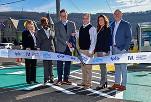 Fast Charger ribbon cutting