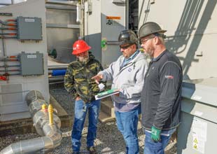 Workers conduct inspections at Gallatin Combustion Turbine Plant as part of a large winterization project