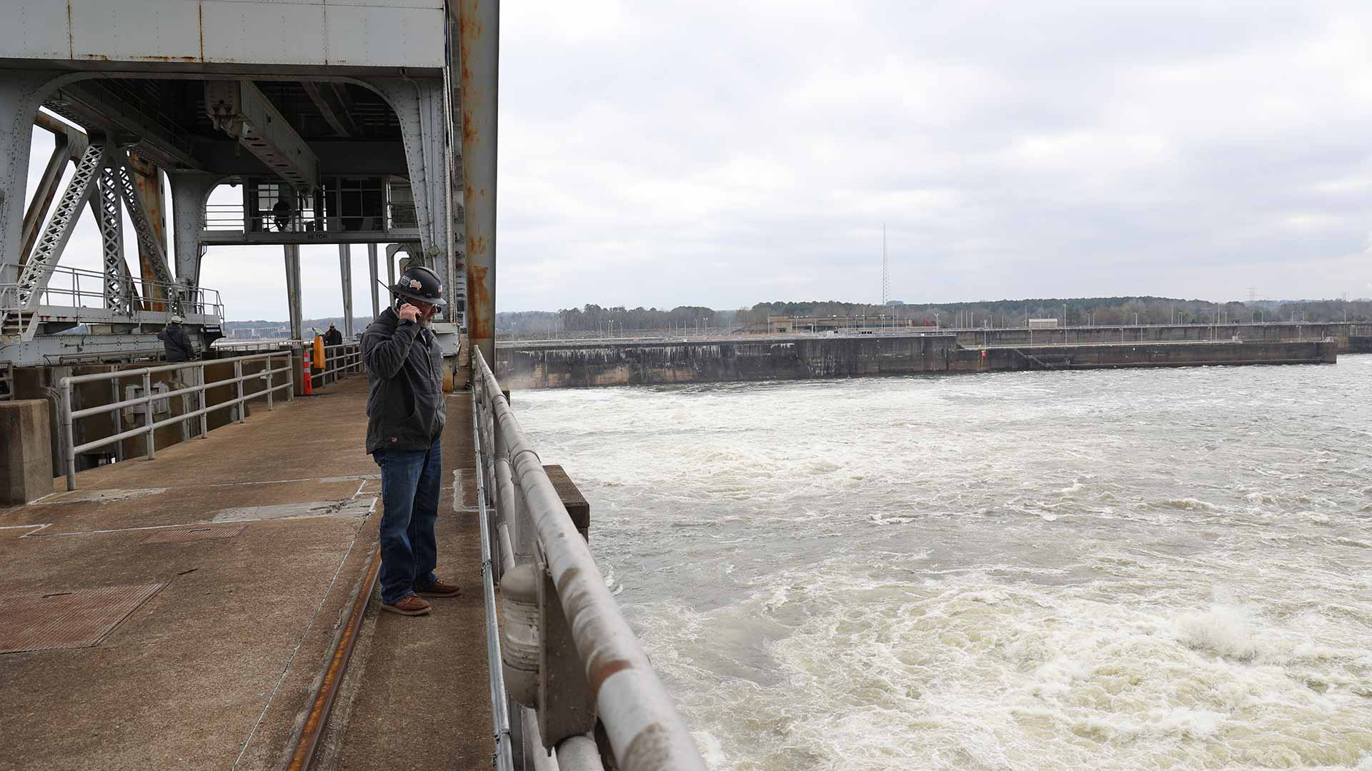 TVA plant manager Jeremy Haddock standing on Pickwick Landing Dam