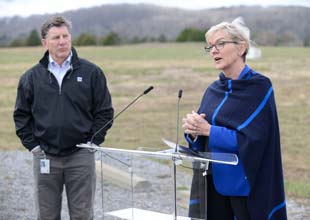 TVA President and CEO Jeff Lyash listens as U.S. Energy Secretary Jennifer Granholm speaks during a visit to the Clinch River site