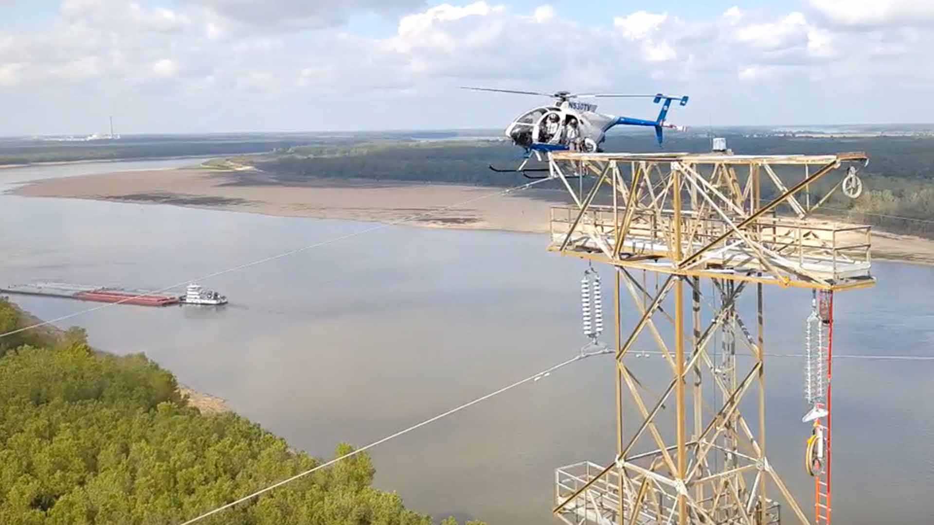 Aviation lineworkers help pull transmission line across Mississippi River