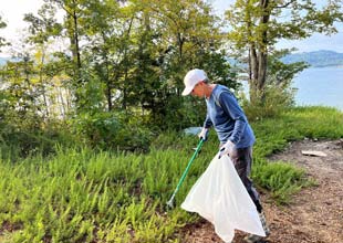 Volunteer cleaning up Norris Lake