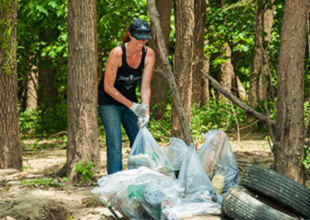 Women cleaning up trash on public land