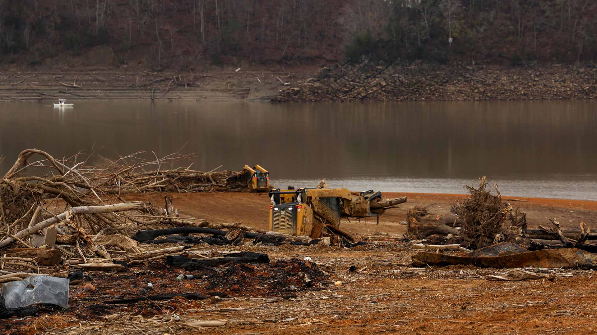 Skid steer piling up debris
