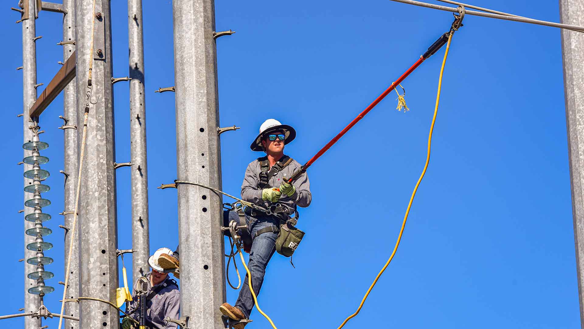 TVA lineworker apprentice demonstrates skills at climbing school in Alabama