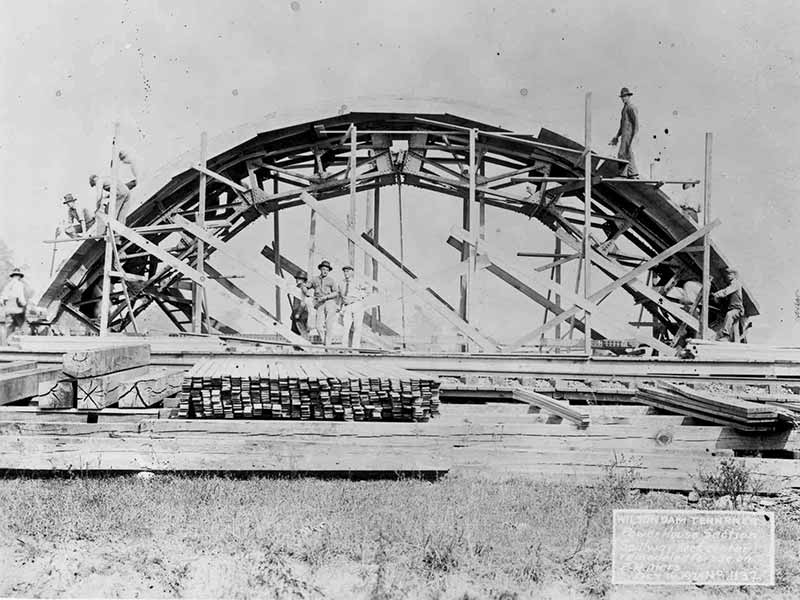 Historic photo of Wilson Dam during construction.