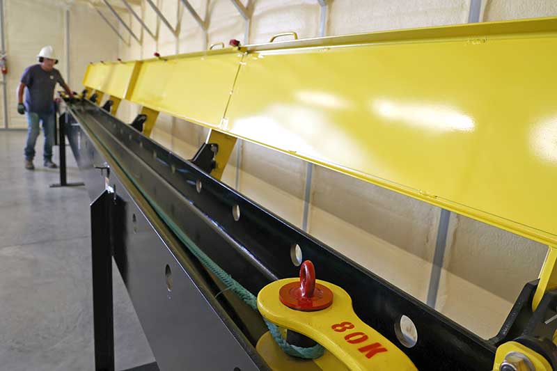 TVA lineworker Vann Smith prepares to break a section of rope on the new strength-testing machine.