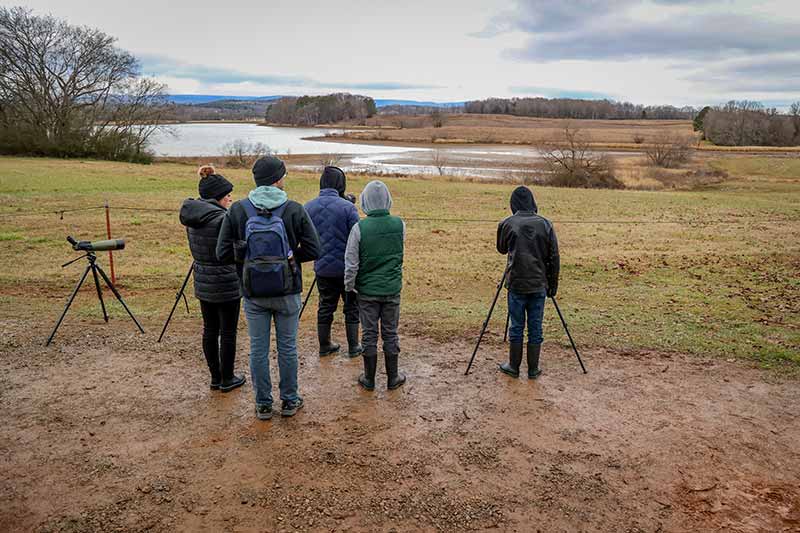 Birdwatchers ready equipment at Hiwassee Wildlife Refuge