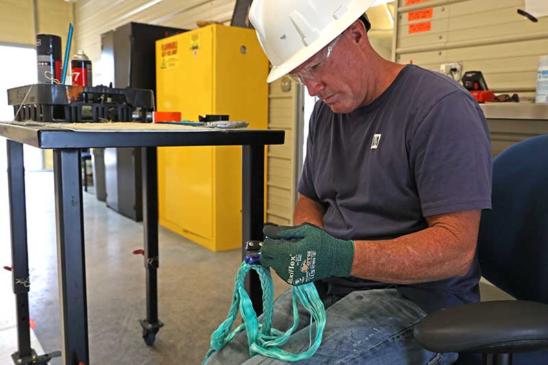 Smith prepares rope for a strength test.