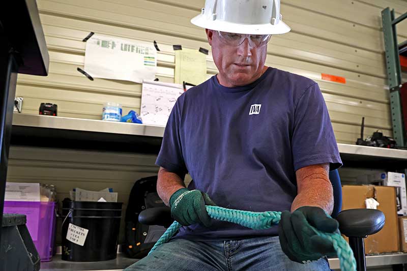 Repairing rope by hand.