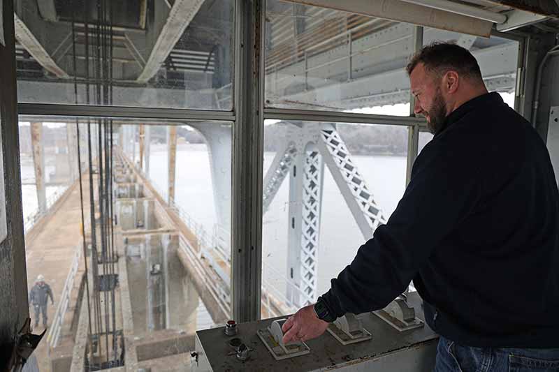 Brady Gregory operates crane at Pickwick Landing Dam