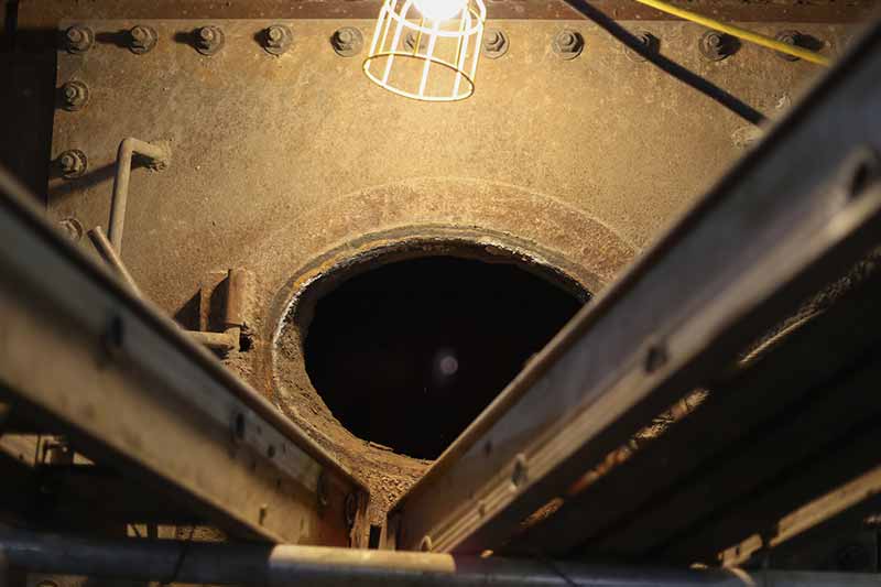 Crews open the bottom of the Unit 1 boiler for cleaning.
