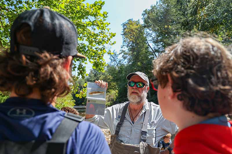 Dave Matthes holds up fish sample
