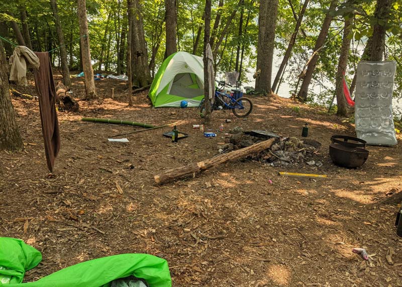 Messy Dirty Campsite with scattered garbage waste in Camping