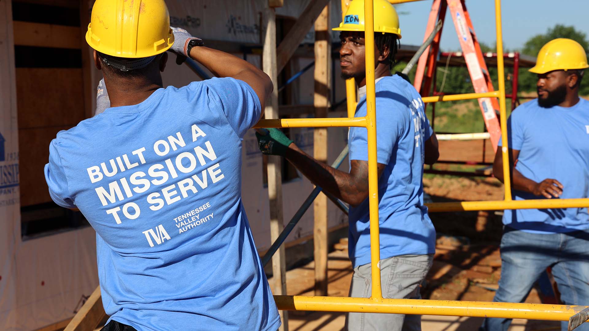 People building a house