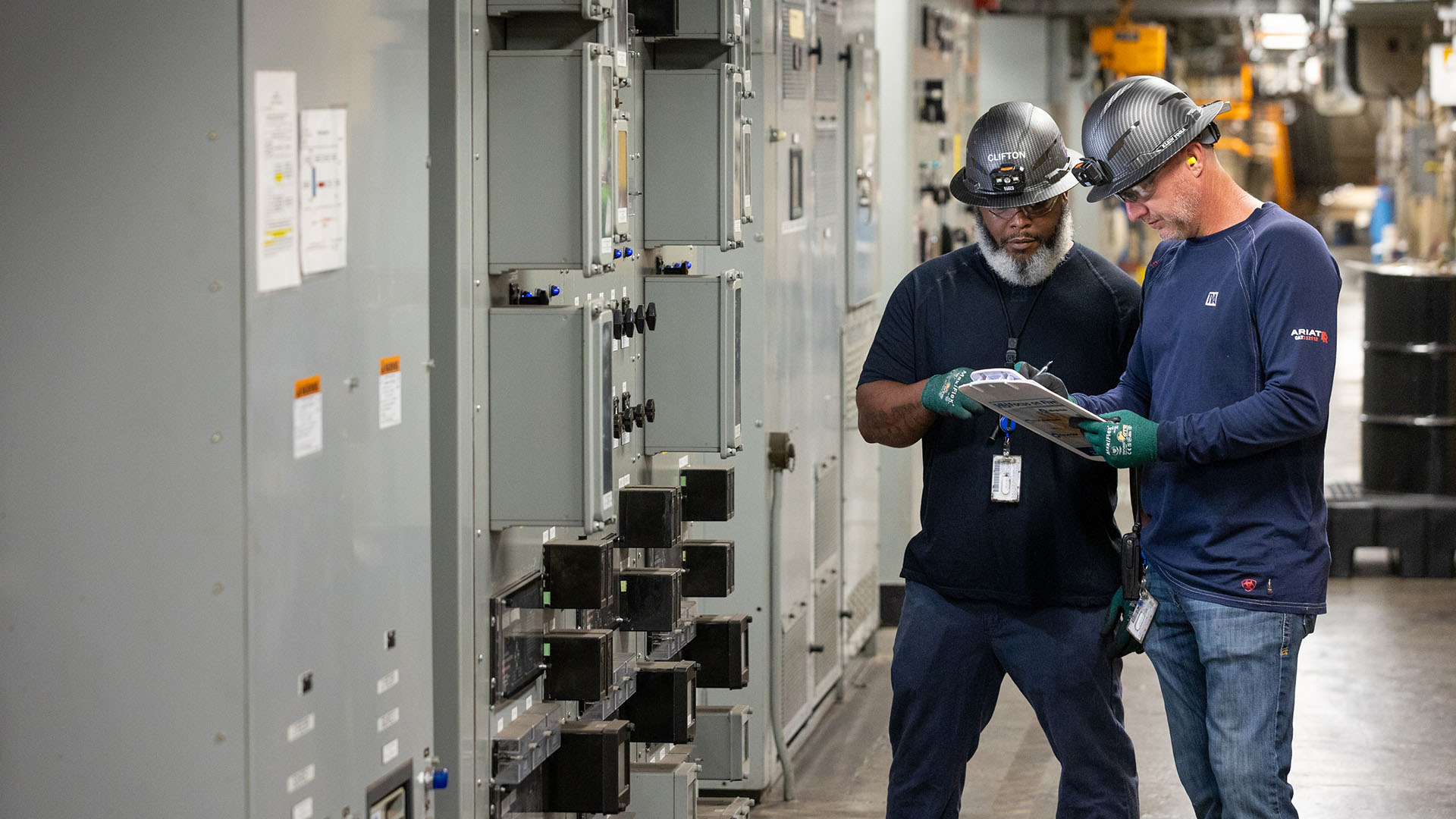 People working at control panel