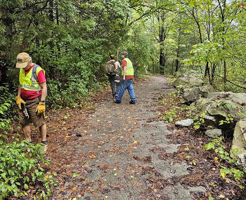 Volunteers work on bike trail.