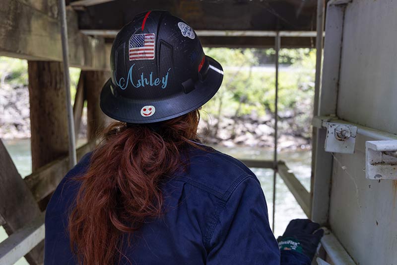 Ashley Griffith works near river at Ocoee Dam