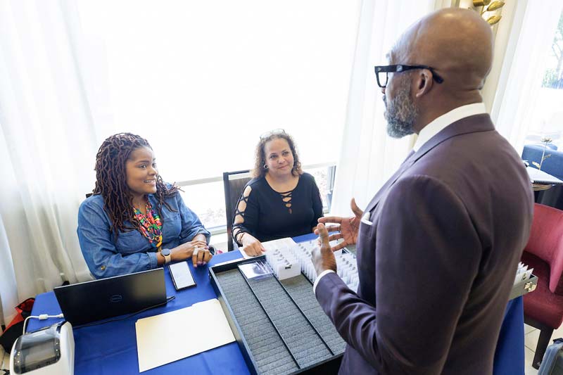 Three attendees chat during the Supplier Diversity Summit earlier this year