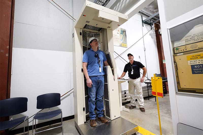 Destin Sandlin with radiation protection instructor Tim Lawson.