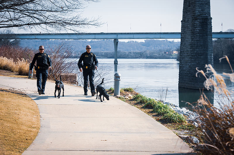 TVA Police and the K-9 partners walk along the Tennessee River in Chattanooga