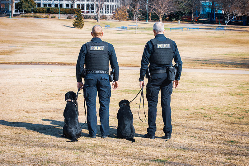 TVA Police with K-9 looking away from camera.