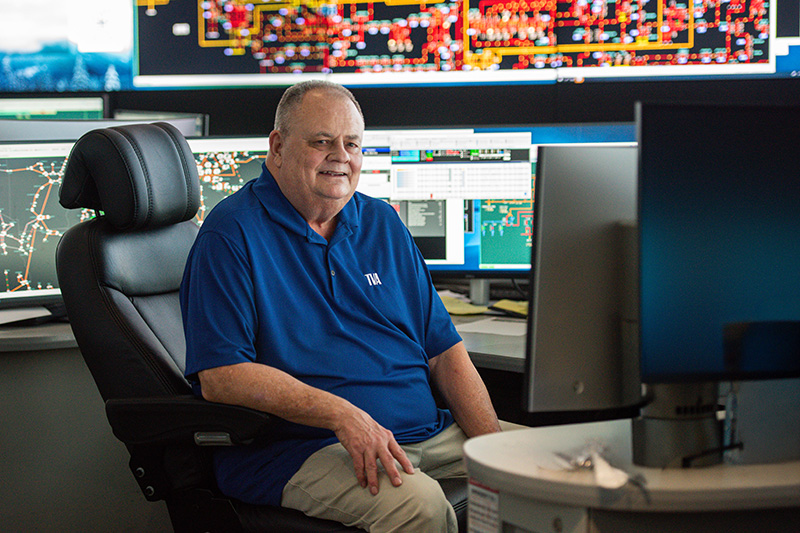 TVA reliability coordinator Chuck Nance sits at a computer station to monitor the power grid