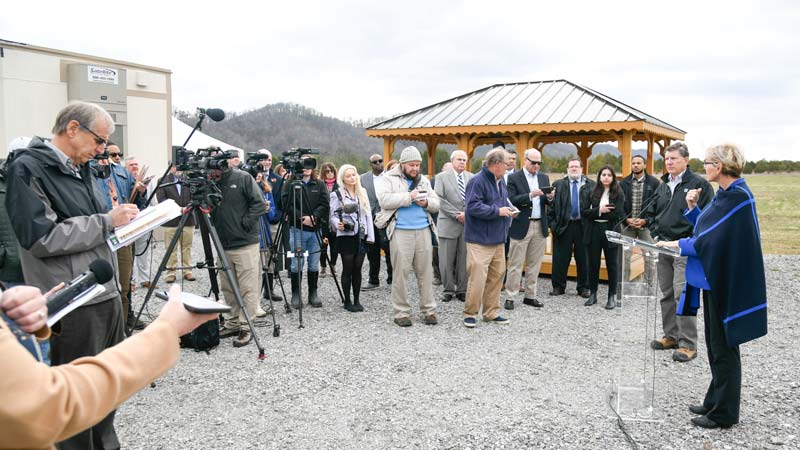 TVA President and CEO Jeff Lyash and U.S. Energy Secretary Jennifer Granholm talk to media and other guests at the Clinch River site