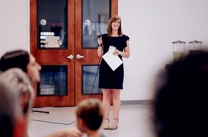 Woman speaking on a microphone