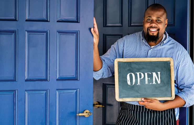 man with open sign