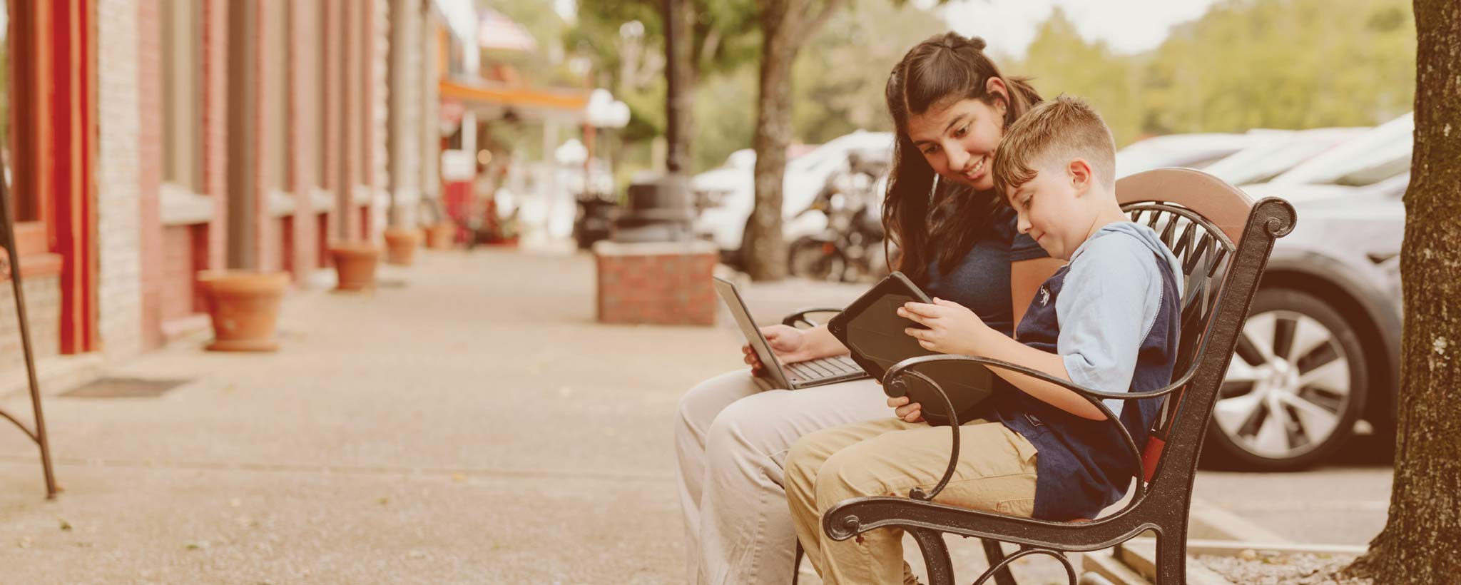 Community Hotspot Mom and Son looking in their iPad