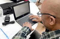 ACTNow member taking test on his laptop