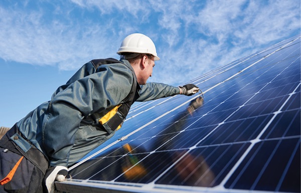 Man working on solar panels