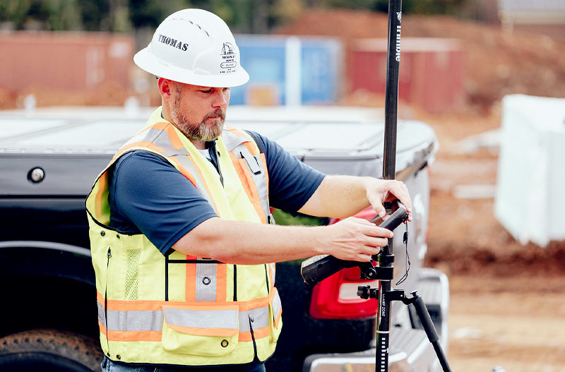 Man measuring to install internet cables