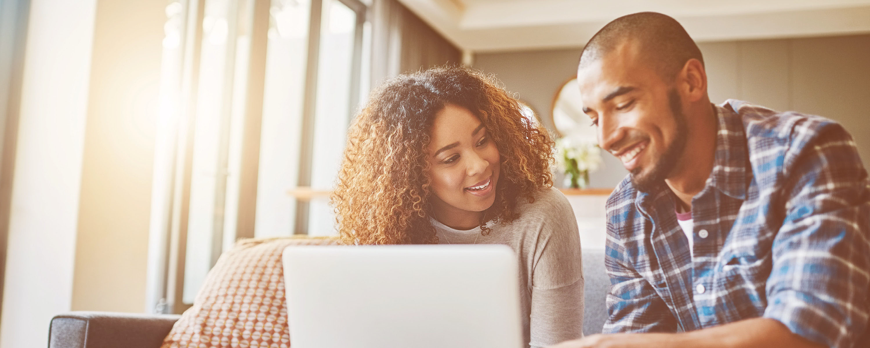 Young couple using a laptop Young couple using a laptop