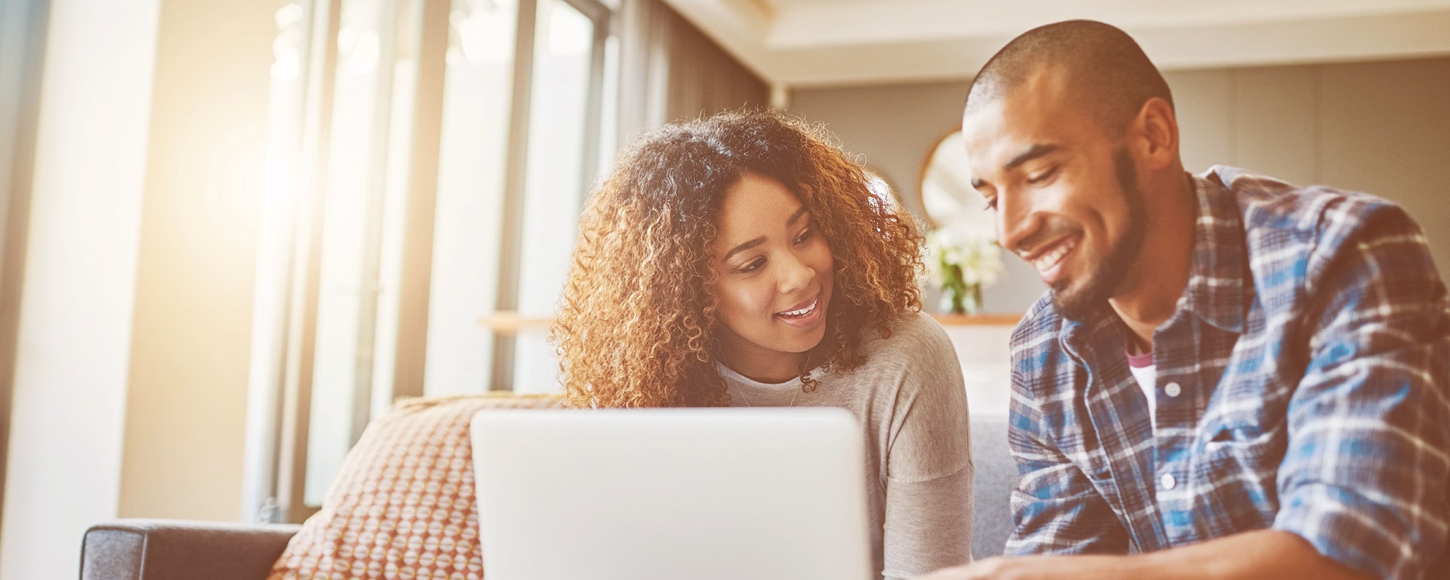 Young couple using a laptop Young couple using a laptop