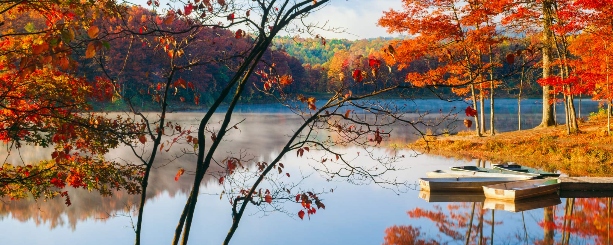 Scenic view of a lake during autumn hero Scenic view of a lake during autumn