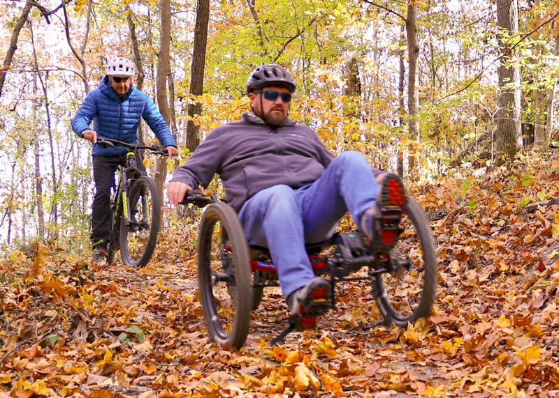 Eric Gray, Catalyst Sports founder, and Anthony Summit, TVA Natural Resources and Recreation senior manager, ride their bikes on Trotter Bluff Trail