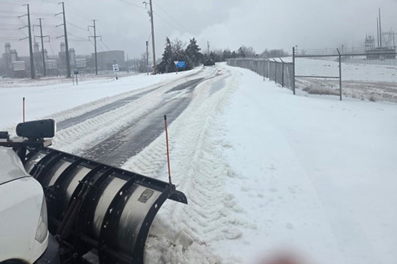 Snow plow on road