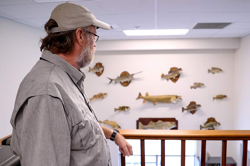 Wall with mounted fish.