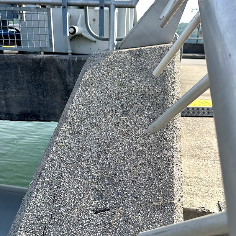Coin impressions can be seen in the staircase near the parking lot of the dam.
