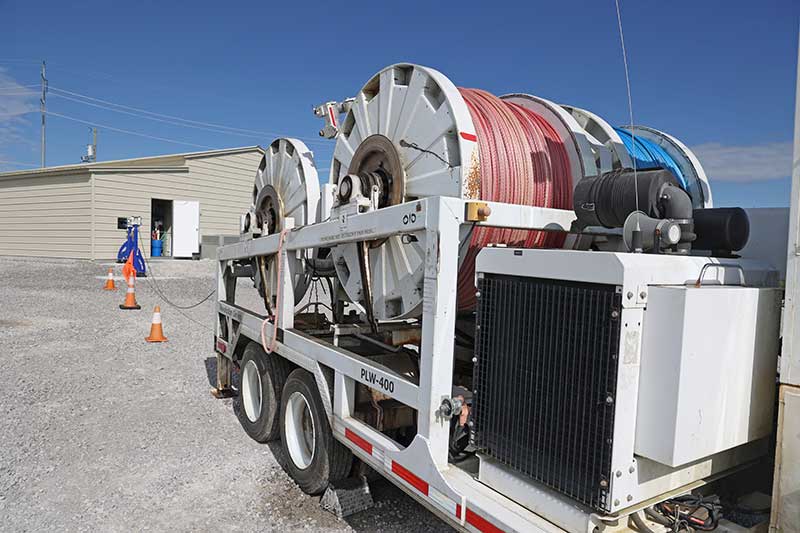 Rope is pulled from a trailer into the facility where it is inspected.