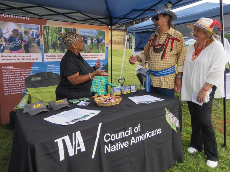 Guests visit at TVA Council of Native Americans booth at the Cherokee Fall Festival