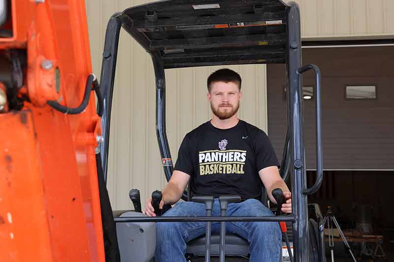Student driving heavy equipment