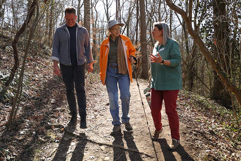 Three people on woodland trail during iSpy workshop