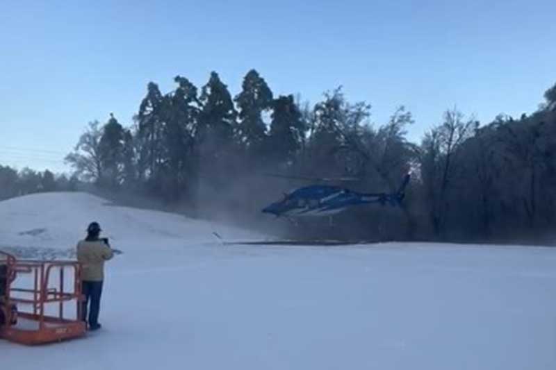 A TVA helicopter delivers supplies to Magnolia Combined Cycle Plant.