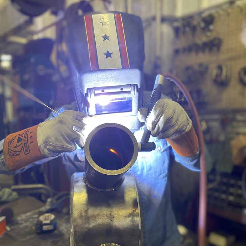 Person welding metal