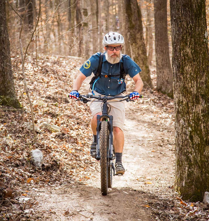 A mountain biker rides at Loyston Point Trail system