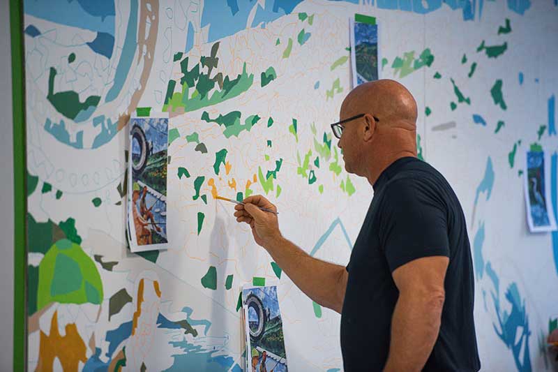 Person painting mural