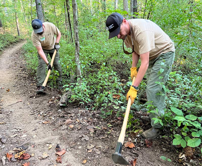 TVA team members clear a trail during National Public Lands Day